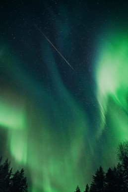beautiful northern lights with a shooting star