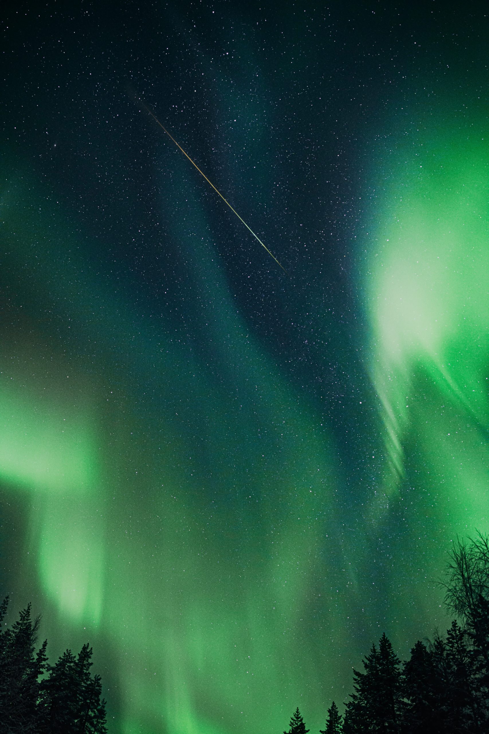 beautiful northern lights with a shooting star